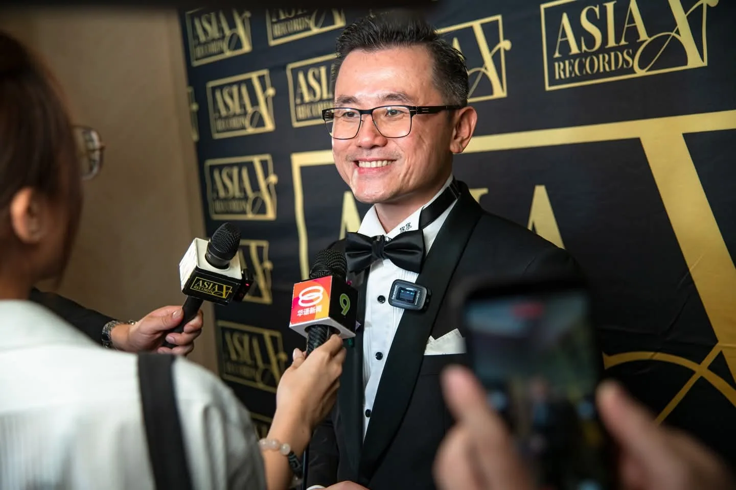 Dato' KK Chua speaking with media at an official event